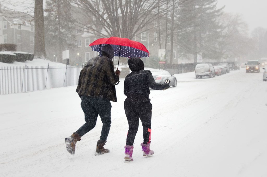 people walking through snow in philadelphia