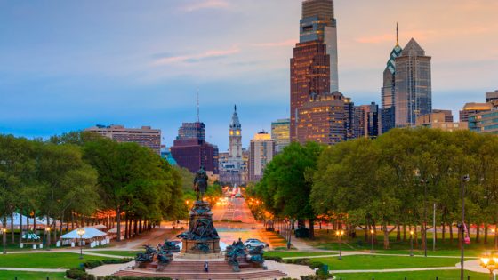 A view of downtown Philadelphia from a park in the evening