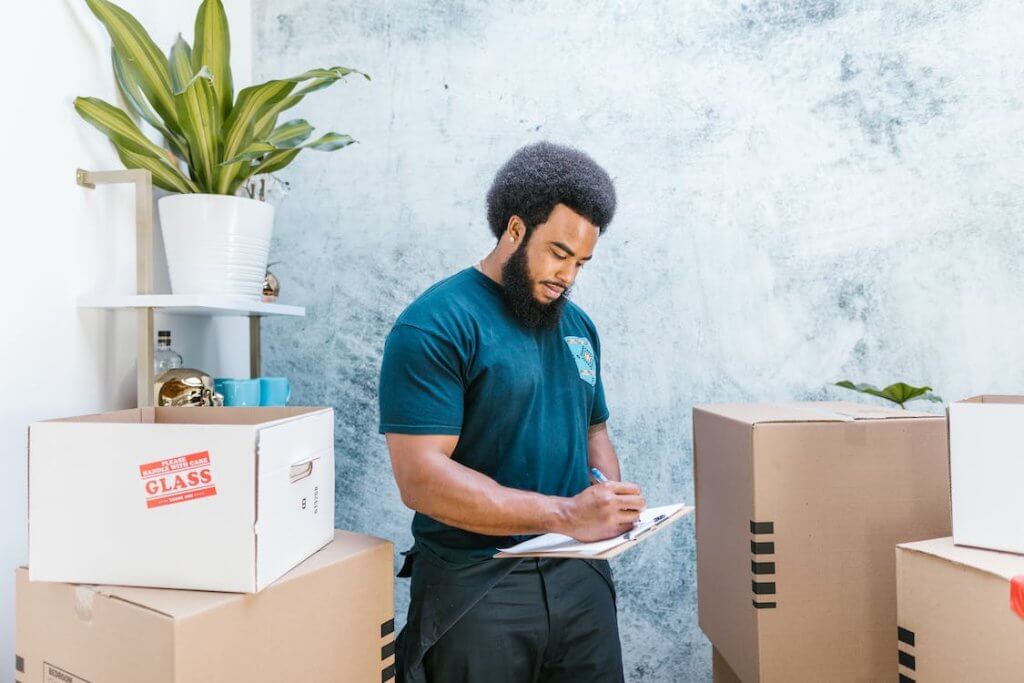 professional mover checking items on a checklist