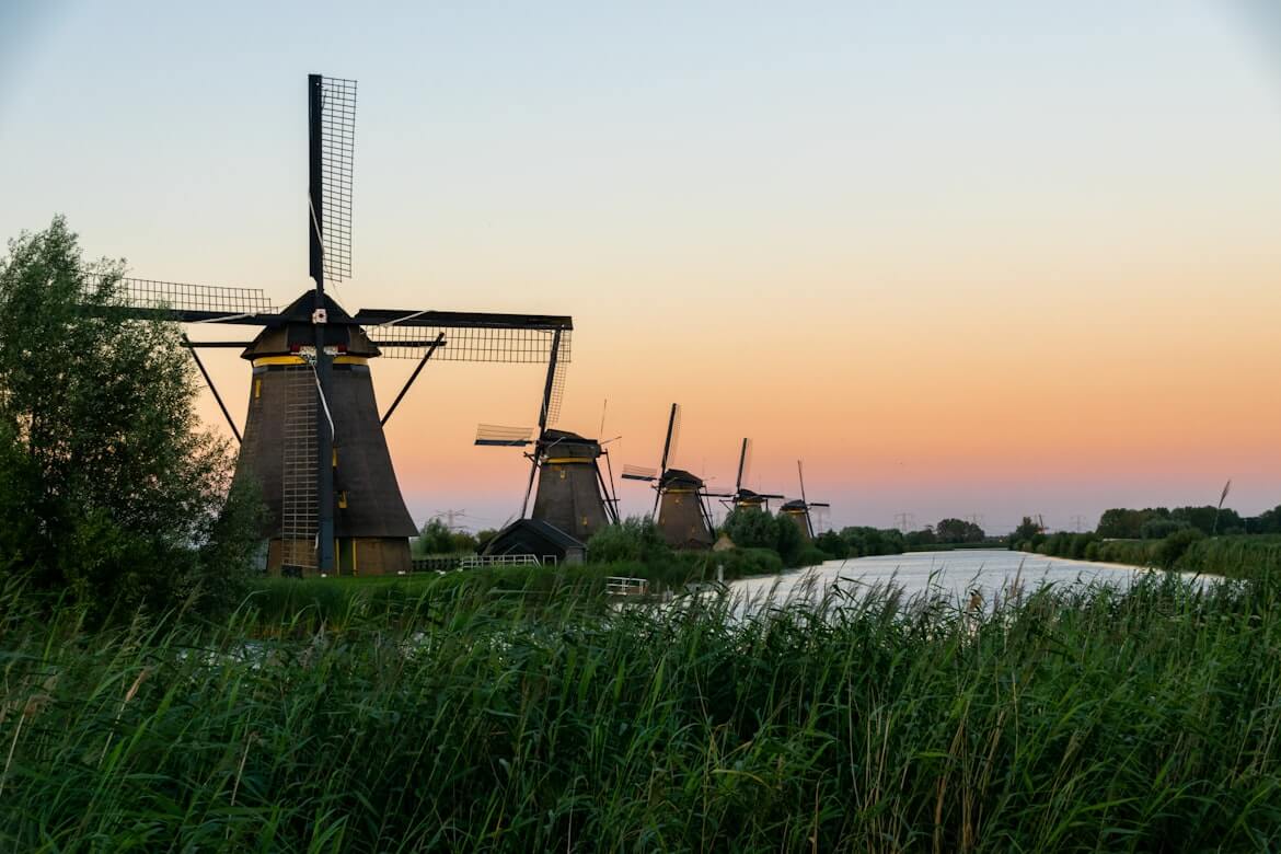 An image of the windmills at sunrise in the Netherlands