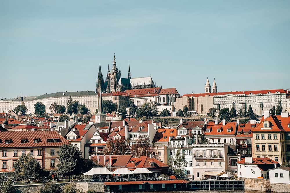 Image showing Prague Castle in the background with city rooftops in front